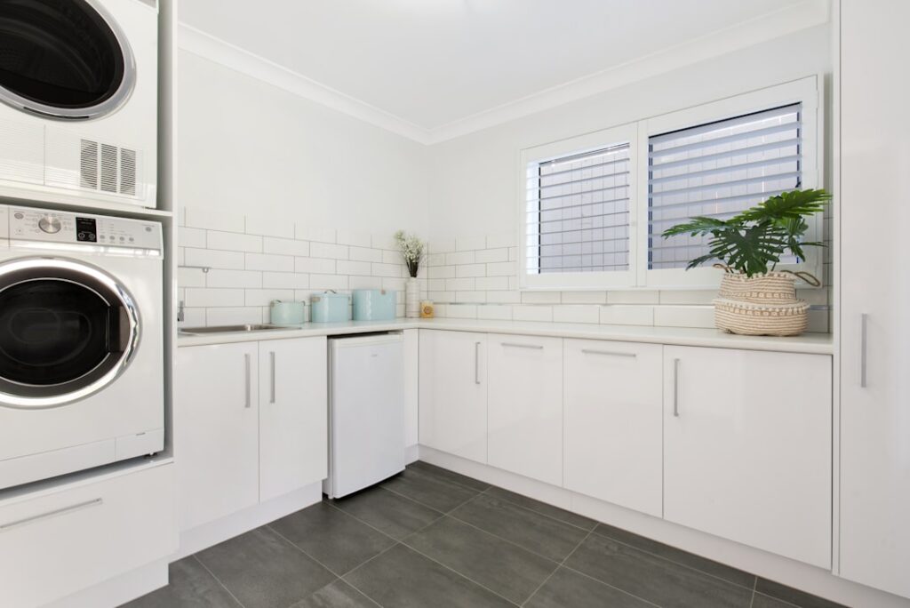 A large laundry room in a house. Thanks for using my photos! If you'd like to attribute credit, please link back to https://www.hausphotomedia.com/