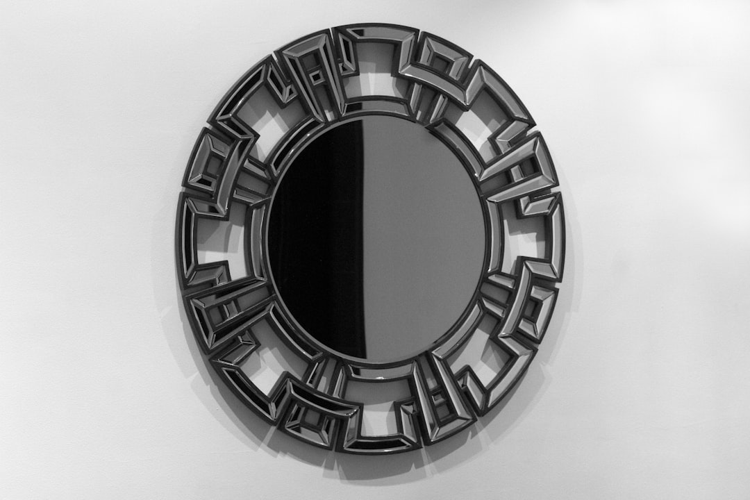 Black and white metal mirror. I can almost hear someone summoning: "Mirror mirror on the wall..."